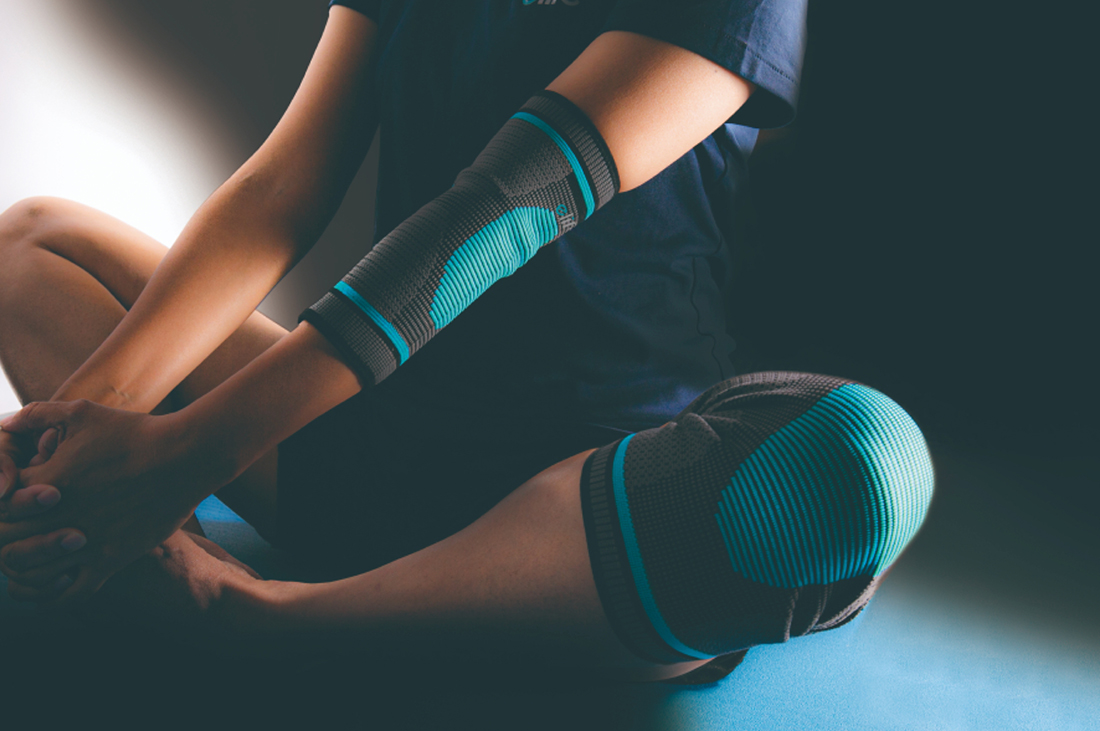A person wearing CIC Orthopaedic products near elbow and knee